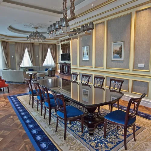 Large Baroque-style dining table in a hotel suite in St Petersburg