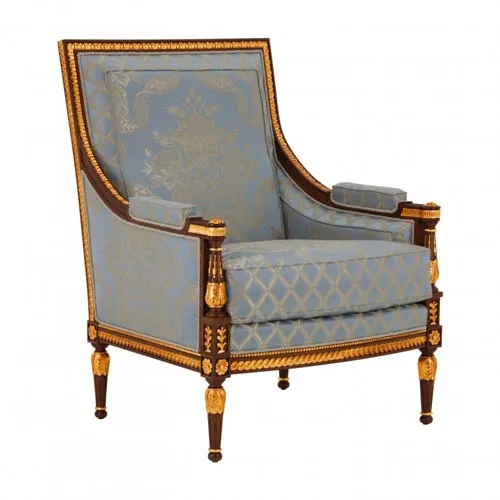 Louis XVI French walnut armchair with gilded leaf detailing