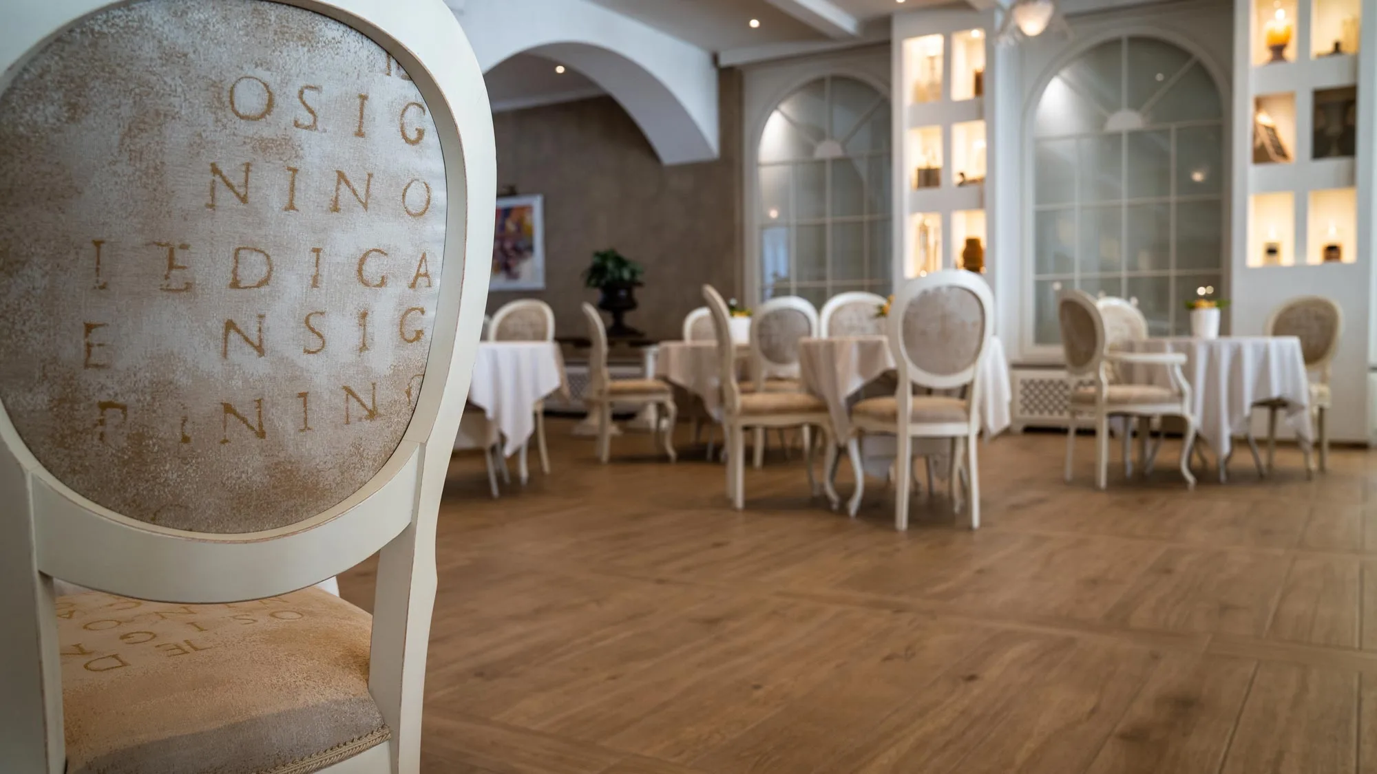 Louis VXI reproduction chairs in the breakfast room of the Grand Hotel Fasano on Lake Garda, Italy